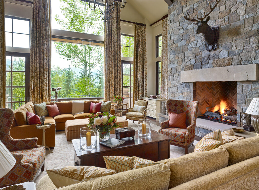 living room with large stone fireplace